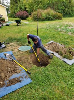 Man working on a septic inspection