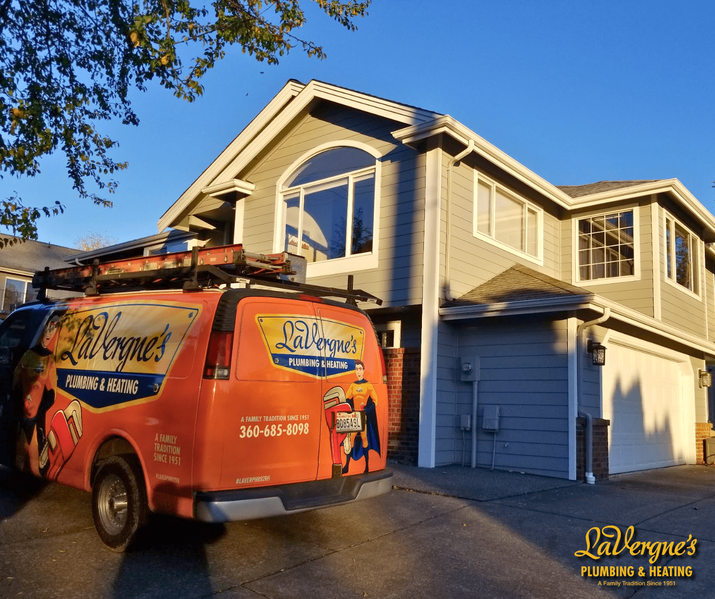 LaVergne Plumbing van outside of a house