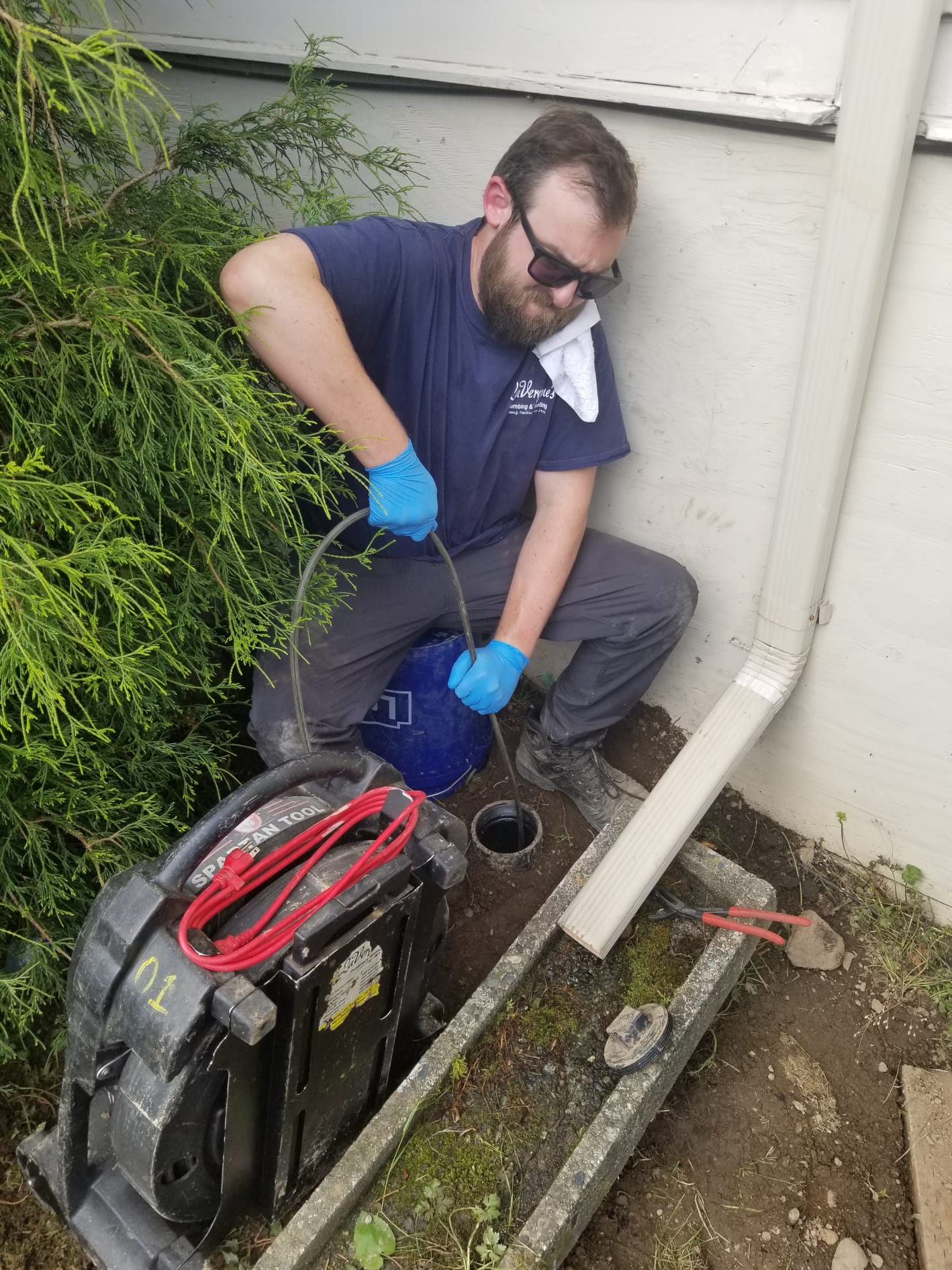 LaVergne's technician leak-testing flare fittings on a mini-split line set connection