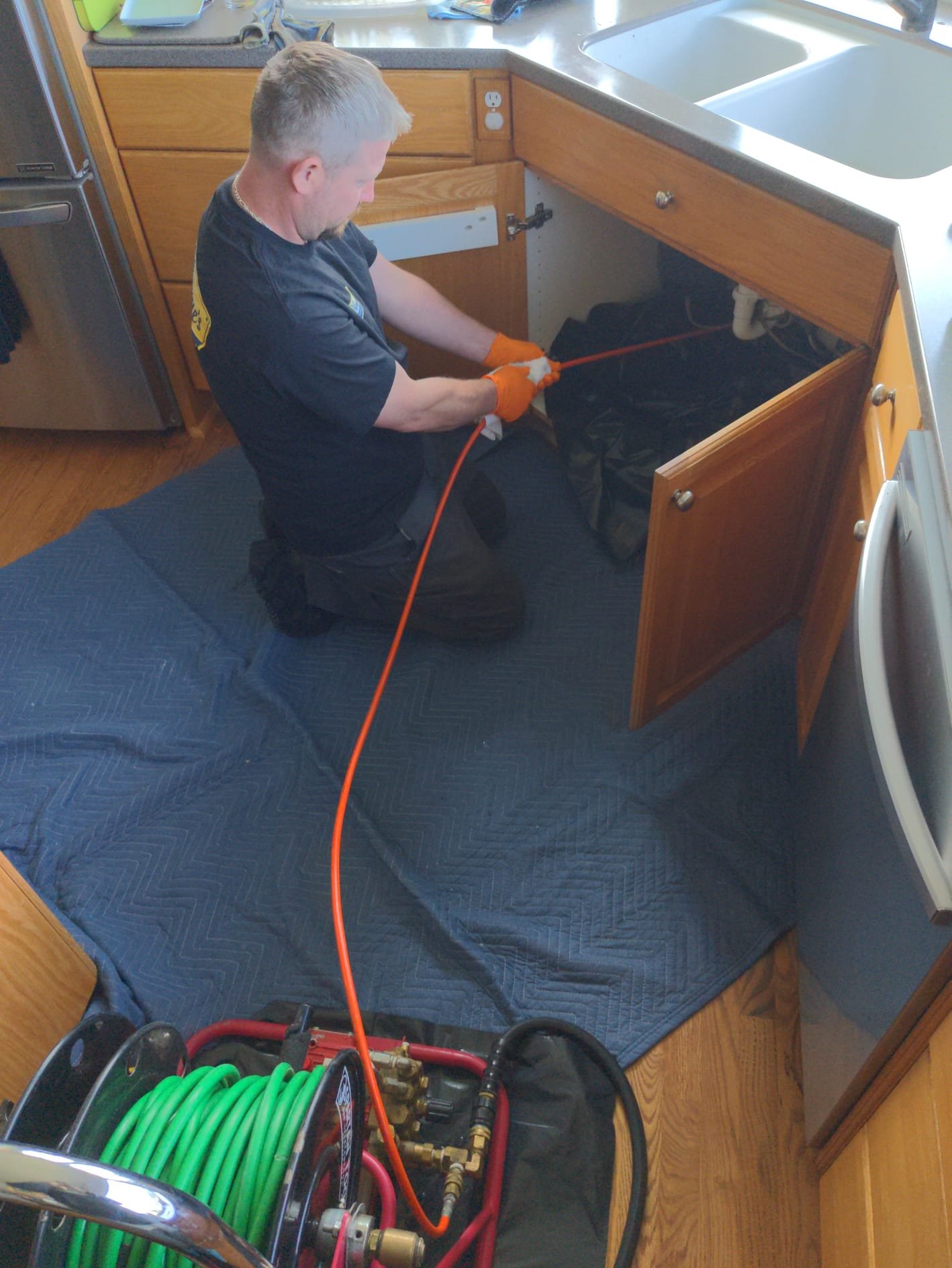 LaVergne's inspector evaluating a residential septic system with tank lids exposed