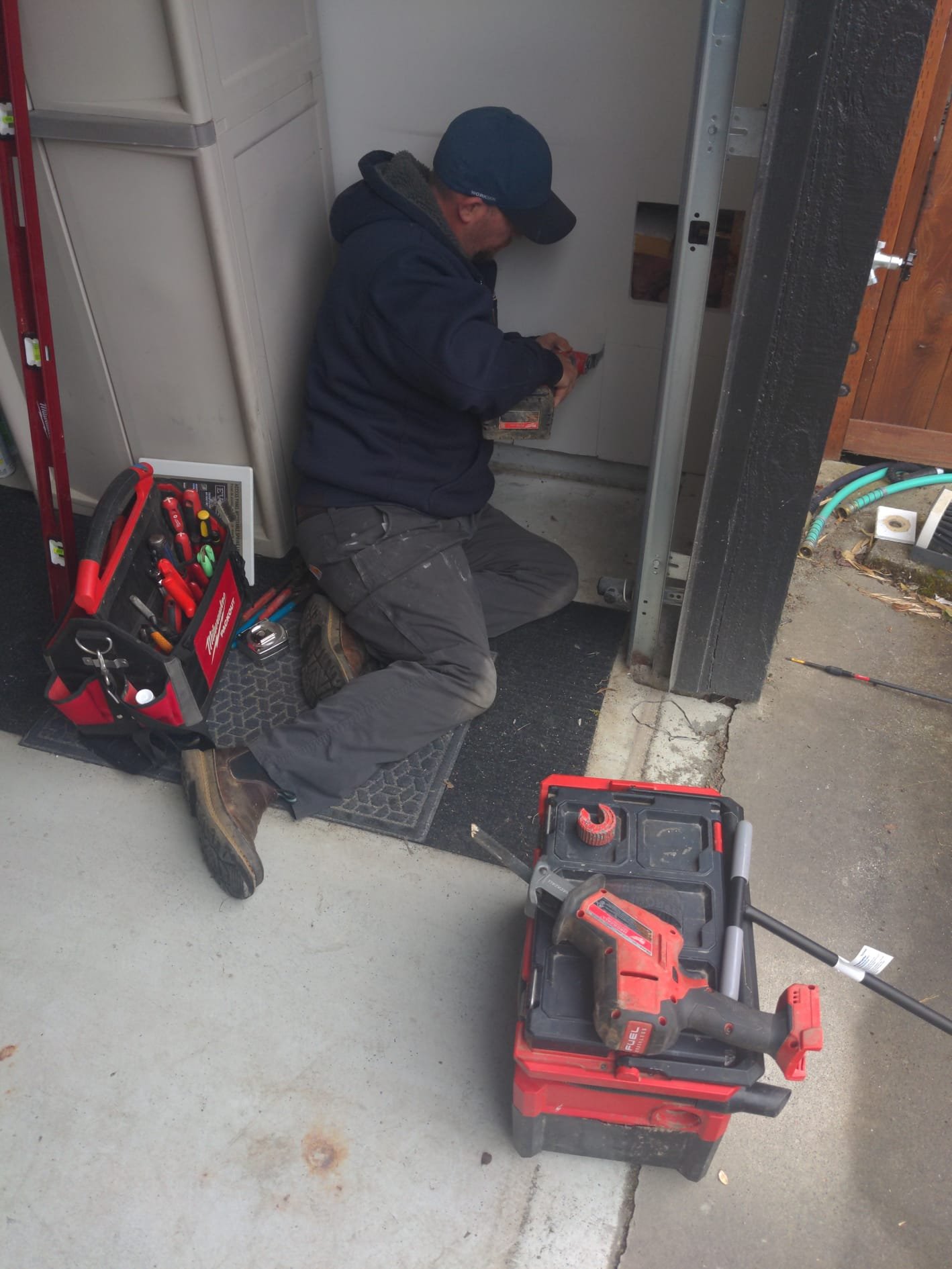 Heat pump water heater operating in a spacious basement utility area of a local home