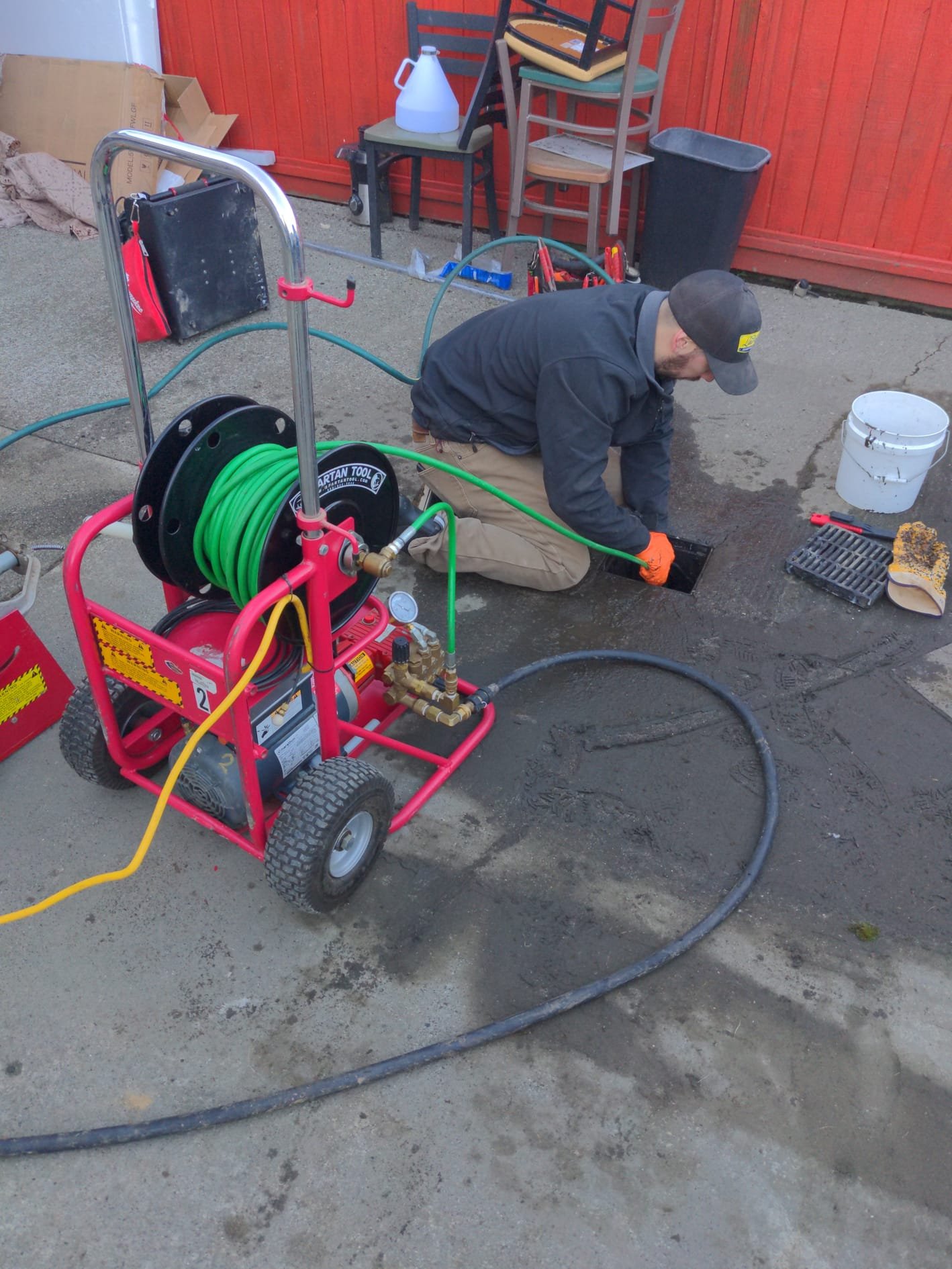 New submersible pump being prepared with drop pipe and safety rope before setting in the well
