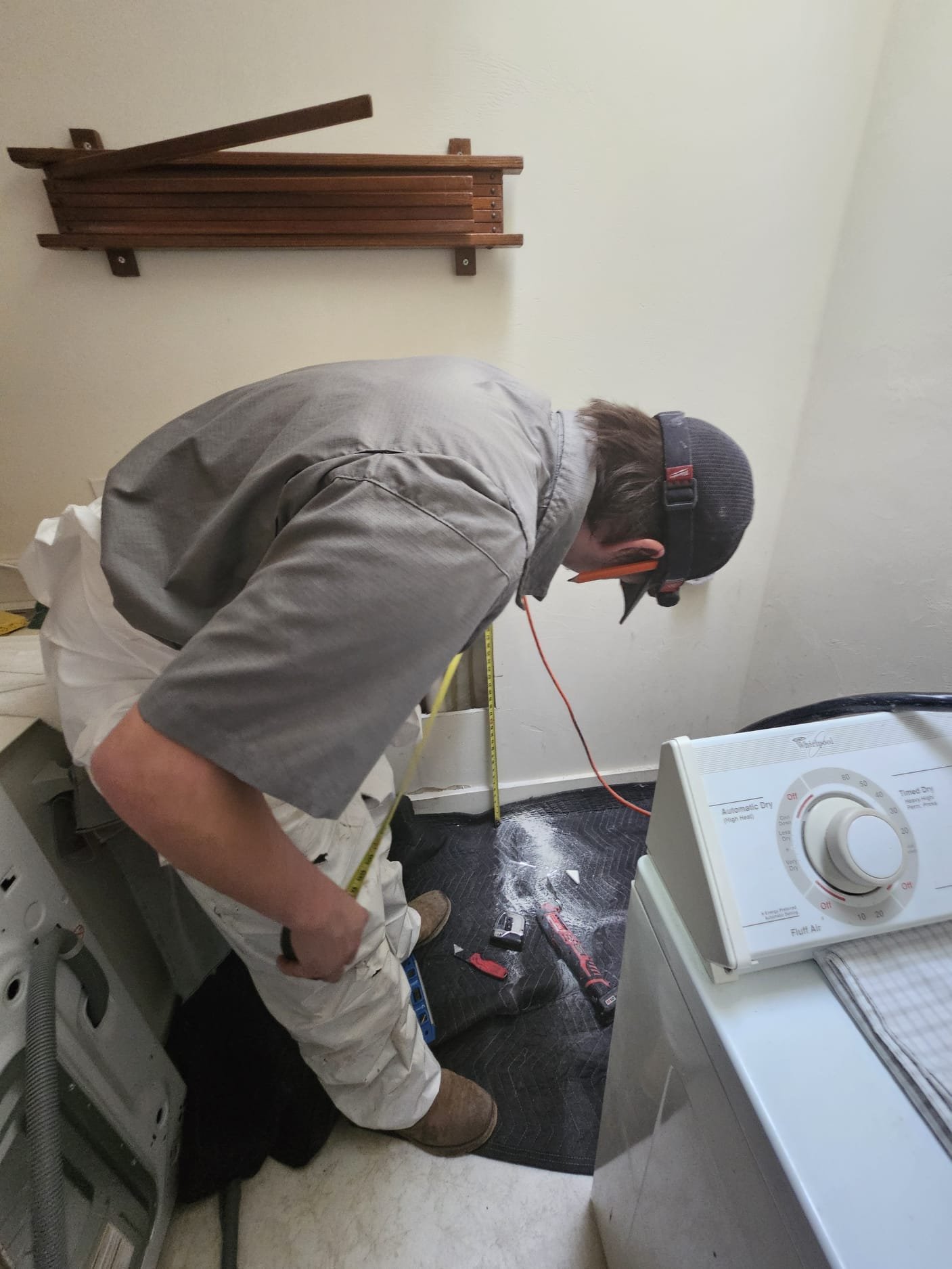 LaVergne's installer connecting gas and water lines to a new tankless water heater