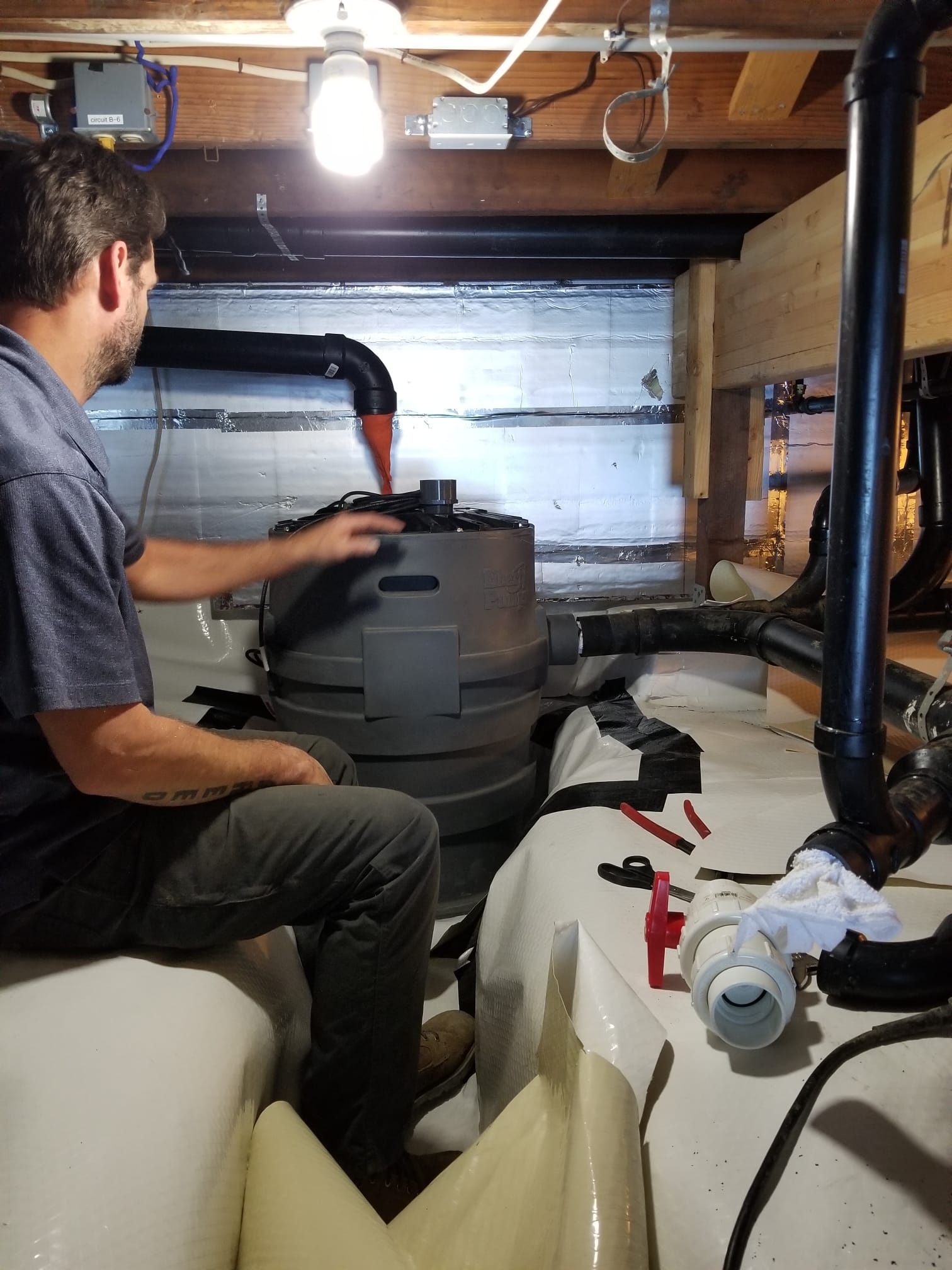 LaVergne's plumber flushing scale from a tankless heat exchanger with a descaling pump