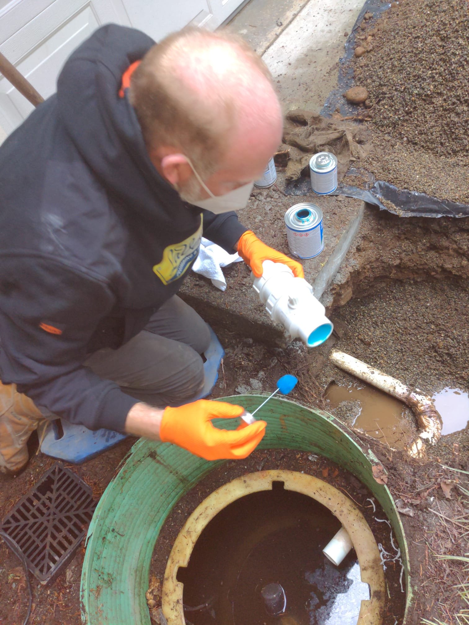 Homeowner keeping clearance around an outdoor heat pump unit between service visits