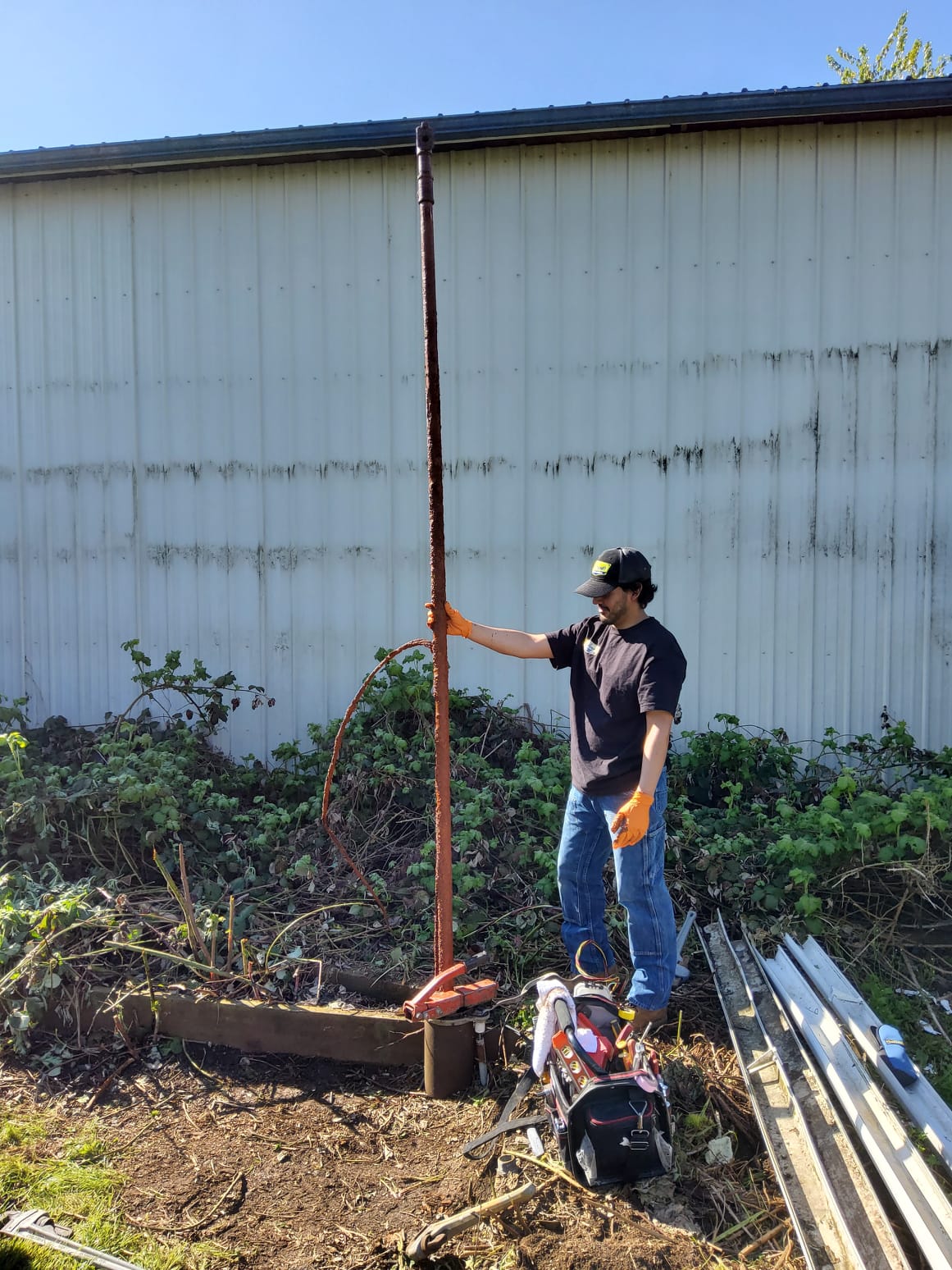 Site evaluation soil test pit dug to assess conditions for a new septic design