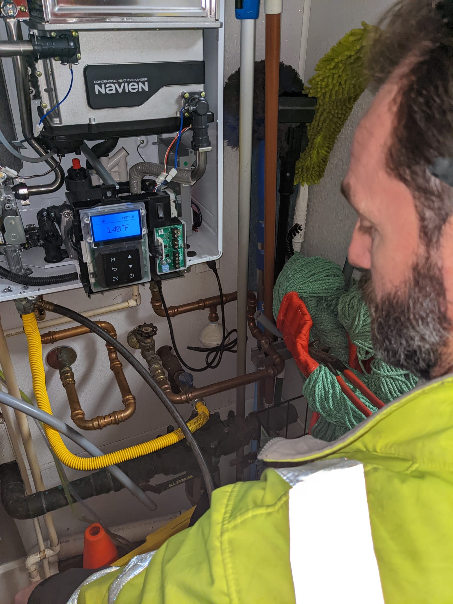 LaVergne's licensed gas fitter using electronic detection equipment at a gas line connection
